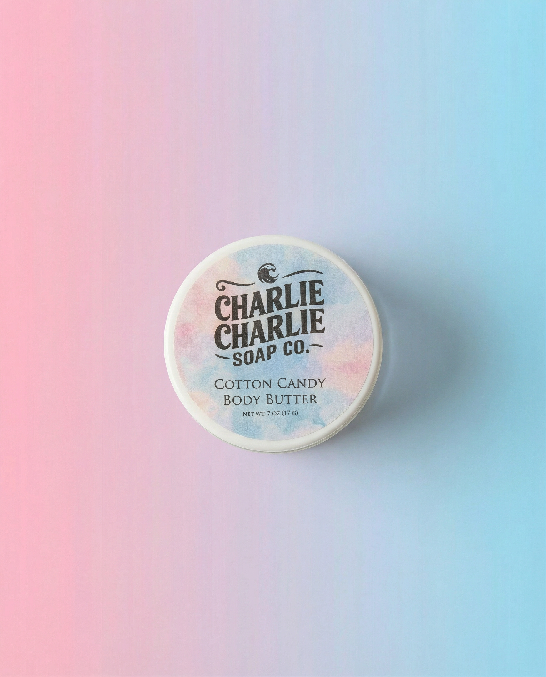 Container of Charlie Charlie Soap Co. Cotton Candy Body Butter on a gradient background