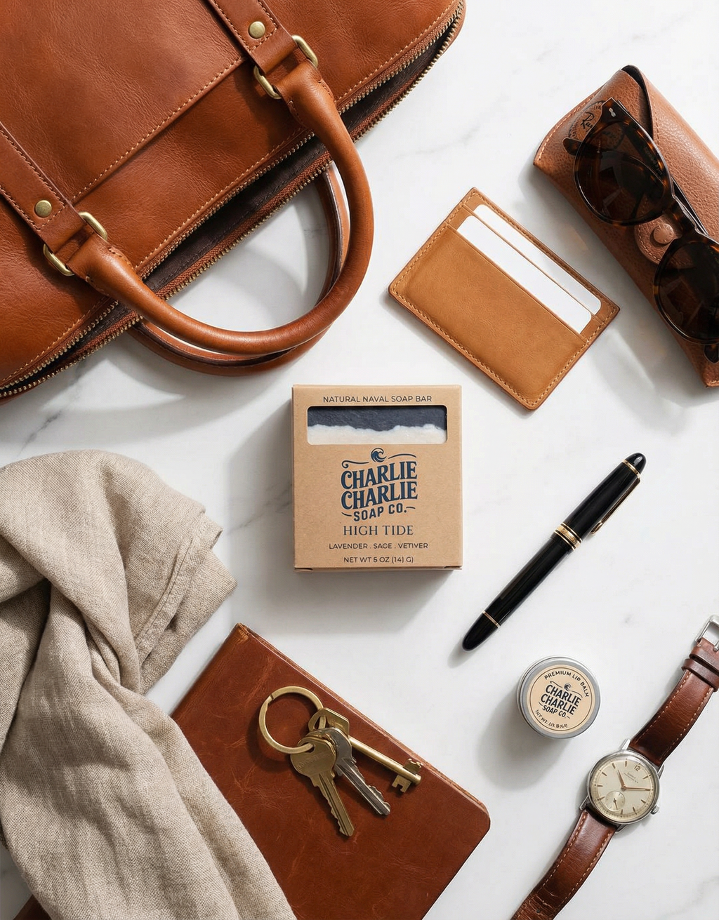 Collection of leather items and accessories on a white surface