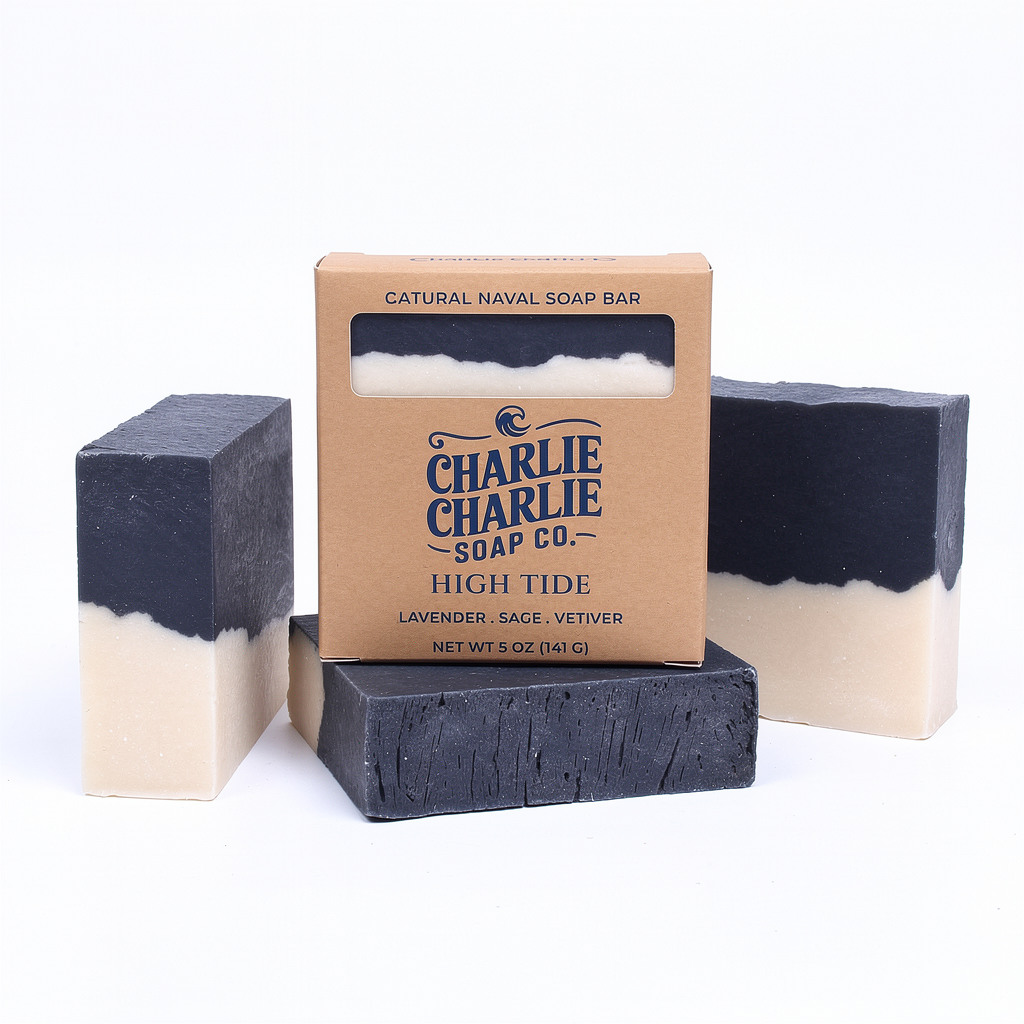 Two layered soap bars with a cardboard box labeled 'Charlie Charlie Soap Co.' on a white background