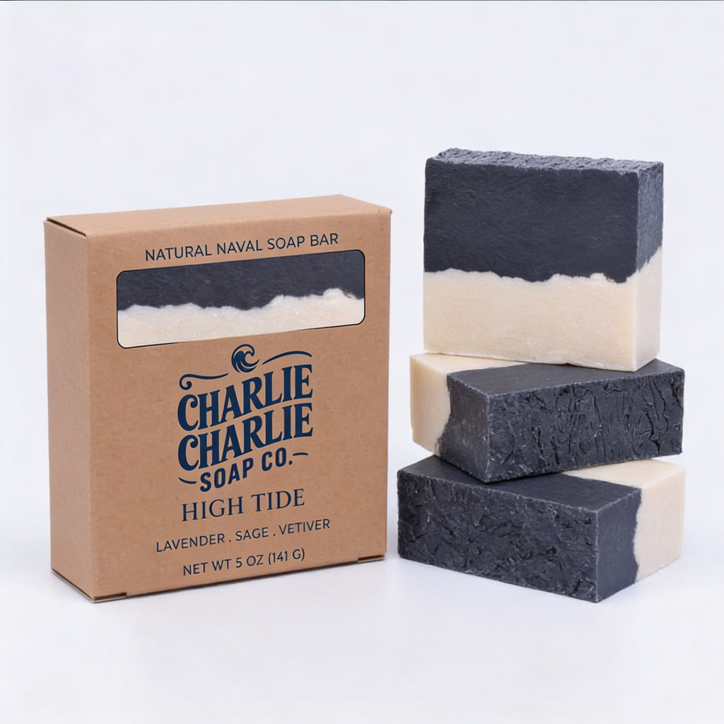 Three layered soap bars with a cardboard box labeled 'Charlie Charlie Soap Co.' on a white background