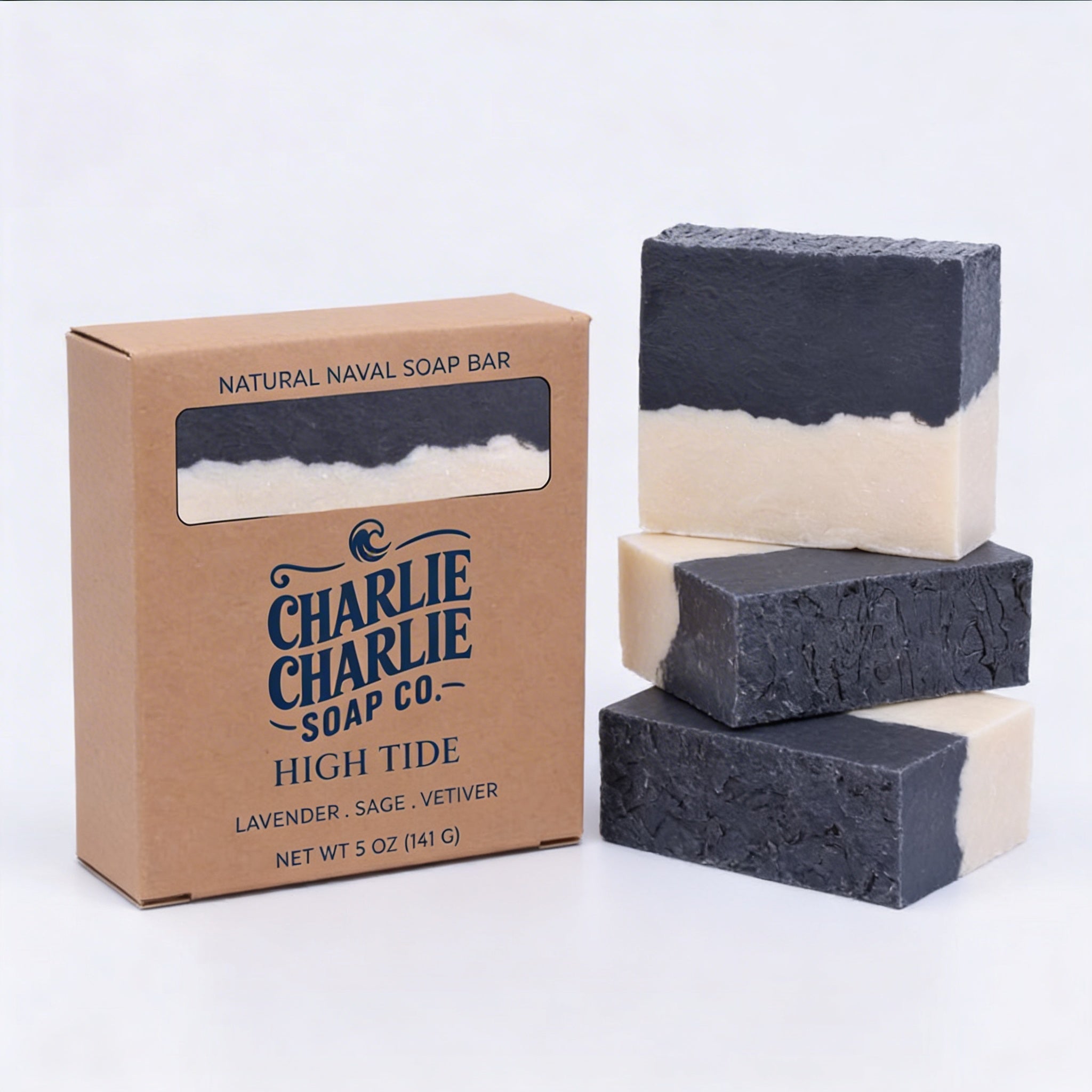 Three layered soap bars with a cardboard box labeled 'Charlie Charlie Soap Co.' on a white background