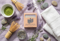 Lavender Matcha soap bar from Charlie Charlie Soap Co. with matcha powder, lavender flowers, and stones on a textured surface.