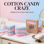 Cotton candy-themed soap bars with packaging on a decorative surface.