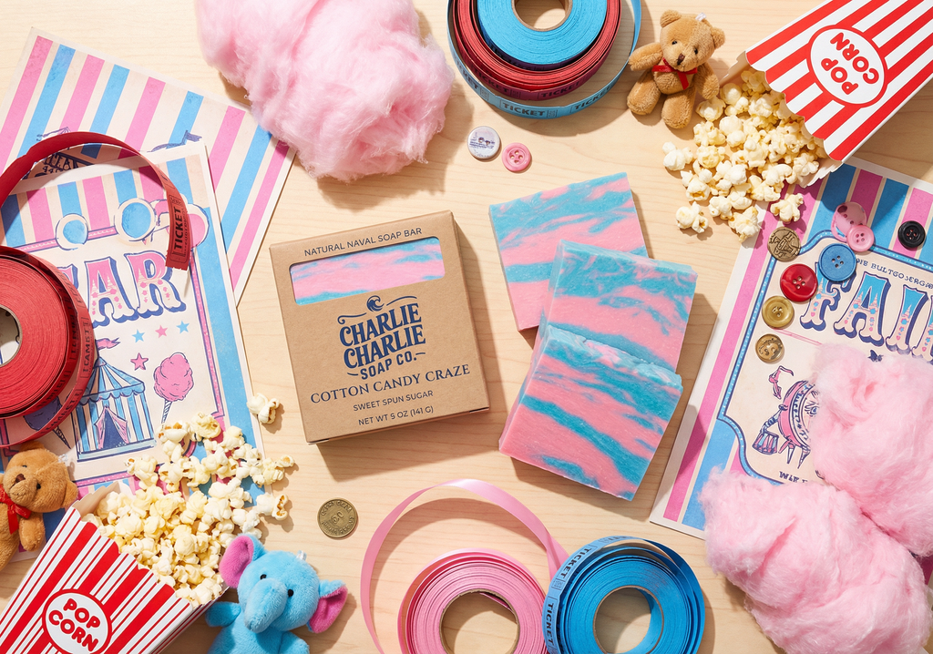 Carnival-themed products including cotton candy, popcorn, and candy canes on a wooden surface.