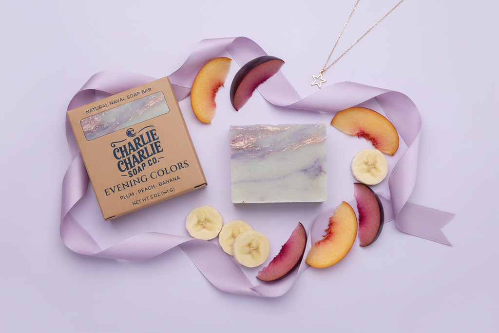 Bar of soap with packaging and fruit slices on a light purple background