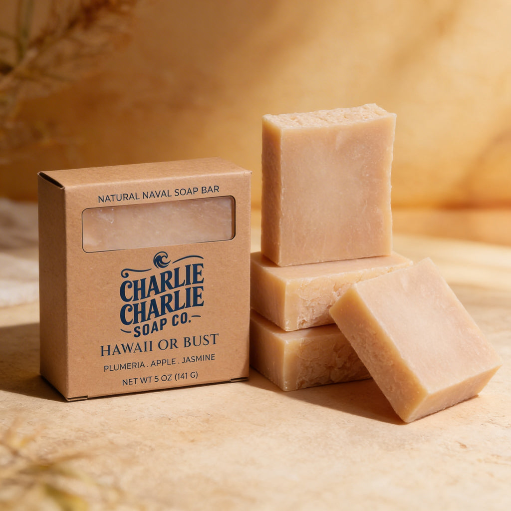 Three natural naval soap bars with a 'Charlie Charlie Soap Co.' box on a beige background