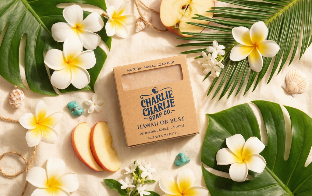 Charlie Charlie Soap Co. bar with tropical flowers and leaves on a light background