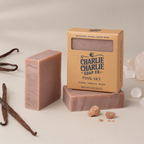 Bar of soap with packaging labeled 'Charlie Charlie Soap Co' on a neutral background