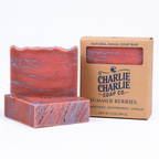 Red and purple marbled soap bar with 'Charlie Charlie Soap Co.' packaging on a white background